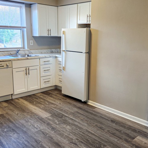 Kitchen with White Appliances at Glen Brook Apartments in Glenolden
